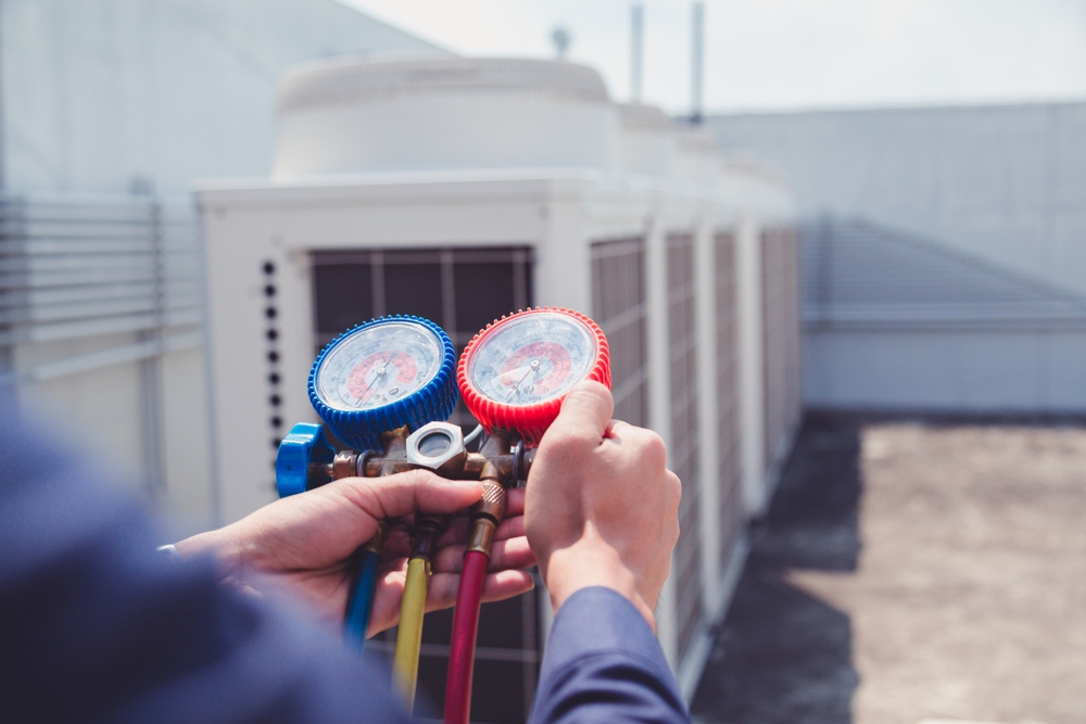 Technician Checking Air Conditioner — Air Conditioning in Dubbo, NSW