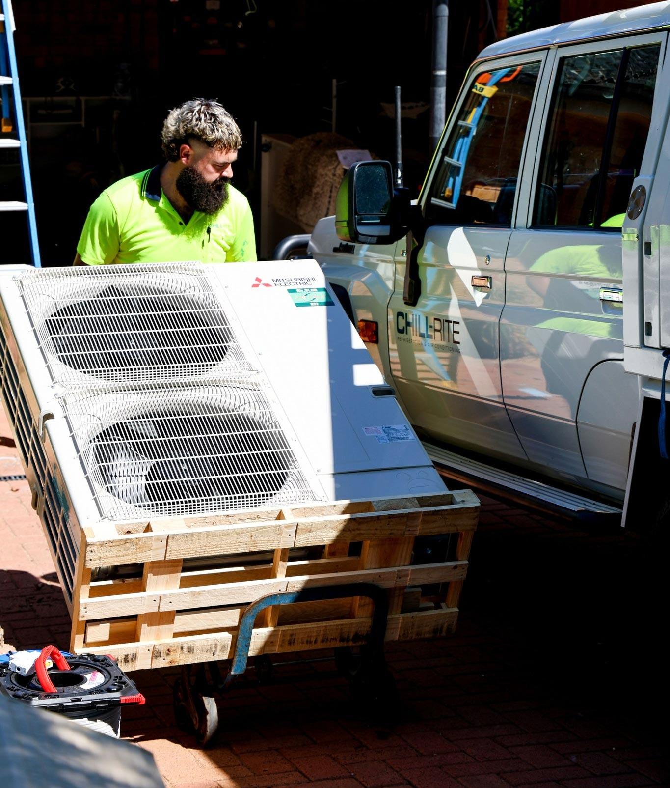 Man Transporting An Air Conditioning Unit